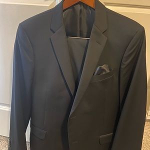 Suit- Jos A Bank- solid black- worn once-jacket size 44, pants size 36